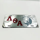 Lambda Theta Alpha Lady on the Moon Mirror License Plate